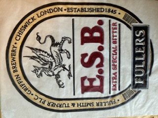 A paper napkin printed with the Fuller&rsquo;s ESB roundel: a griffin above the letters E.S.B., ringed with the words Fuller Smith & Turner PLC, Griffin Brewery, Chiswick London, Established 1845.