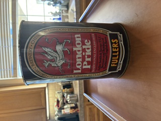 A large London Pride party can in old Fuller&rsquo;s livery, the griffin above the words London Pride and Traditional English Beer, standing on a kitchen counter.