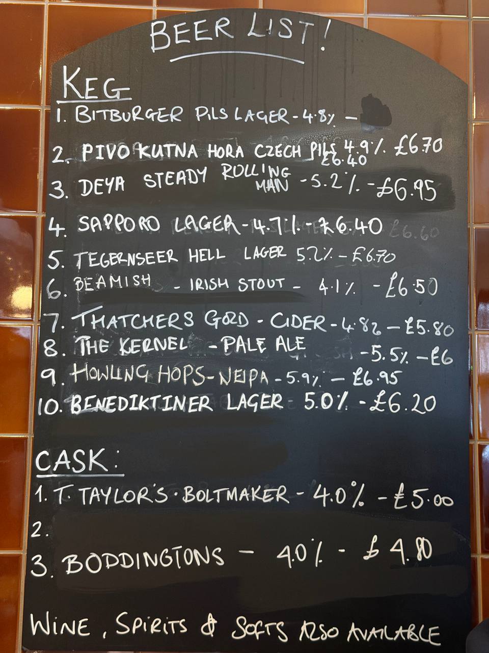 Beer list chalkboard at The Whippet, June 2026: ten keg lines including Bitburger, Kutna Hora, Sapporo, Tegernseer Hell and Benediktiner, plus three cask handpulls