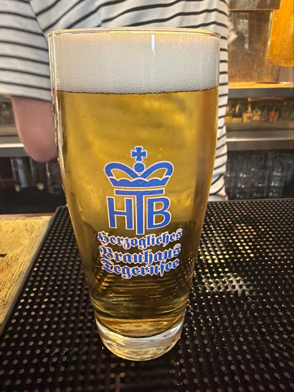 Tegernseer Hell poured into the proper HTB Herzogliches Brauhaus Tegernsee crown-and-cross glass at The Whippet